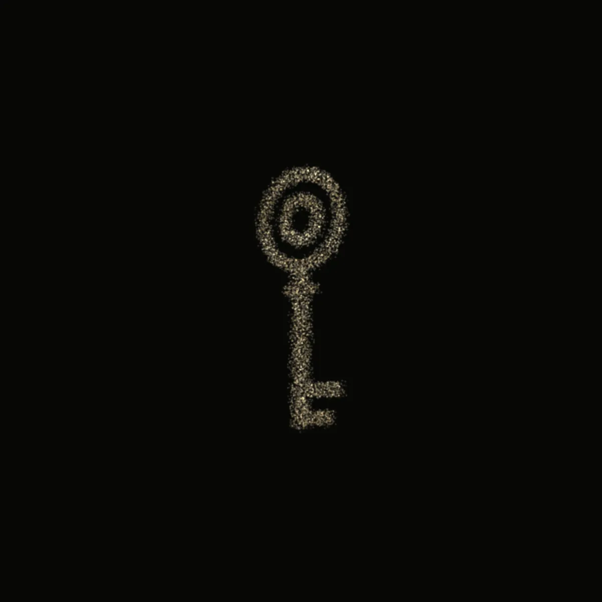 A key formed from fine gold dust on black