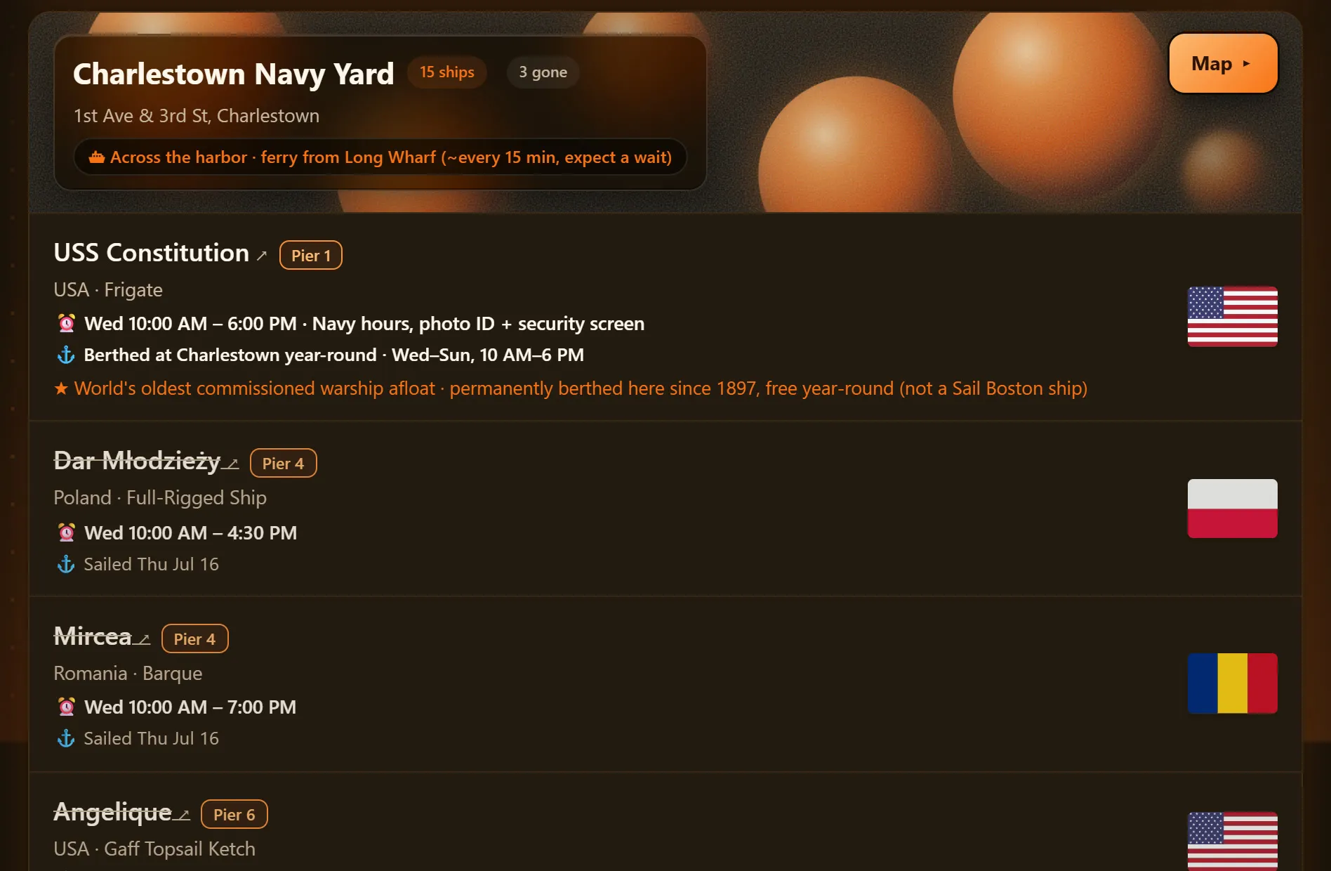 A pier header with orange spheres above ship rows with pier tags and flags